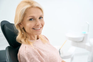 Happy, smiling woman in a dental chair